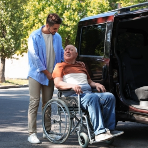 caregiver and elderly going in the van