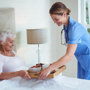 caregiver assisting elderly