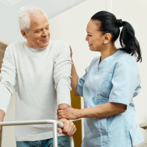 caregiver assisting elderly