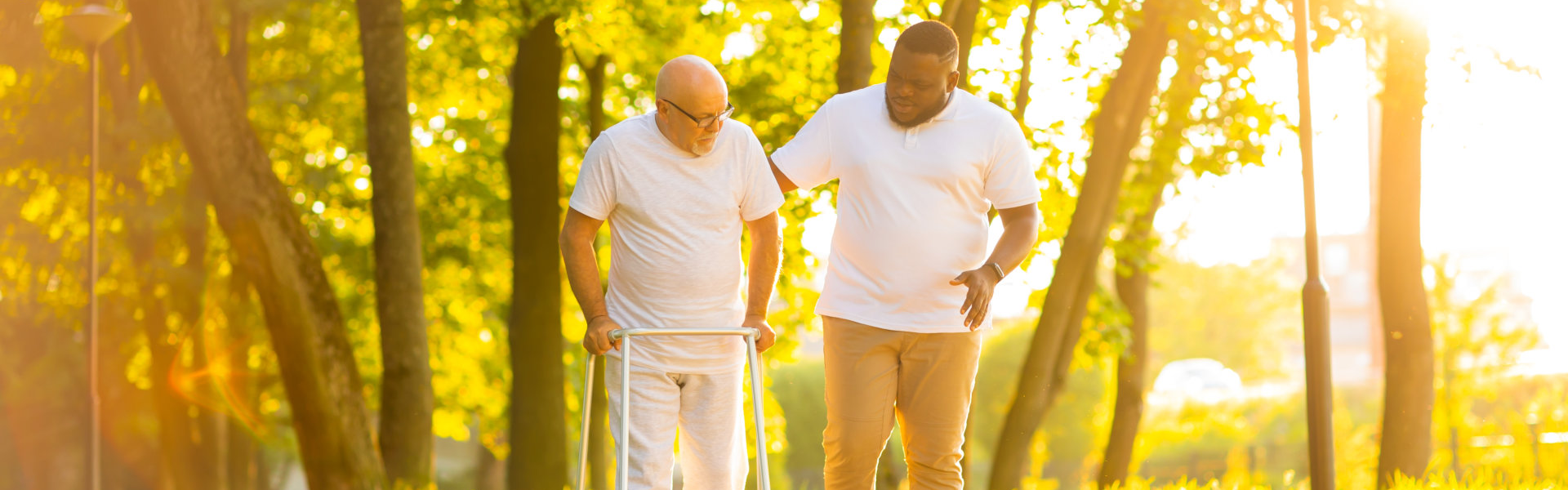 caregiver and elderly walking