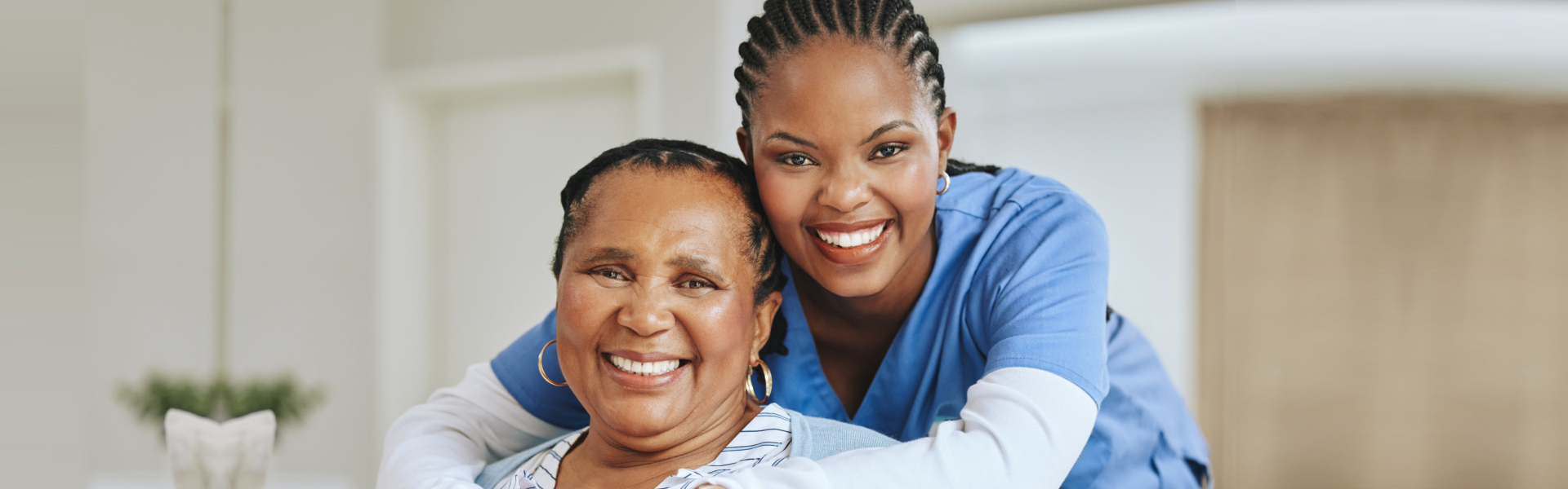 caregiver hugging the elderly