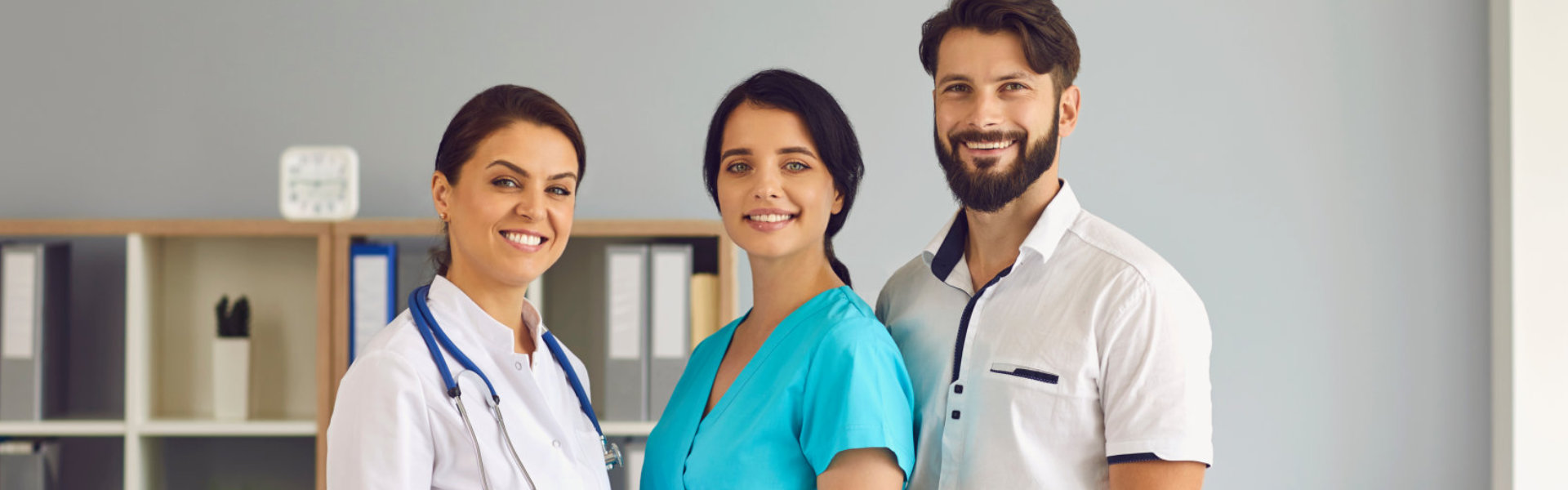 doctor and caregiver smiling