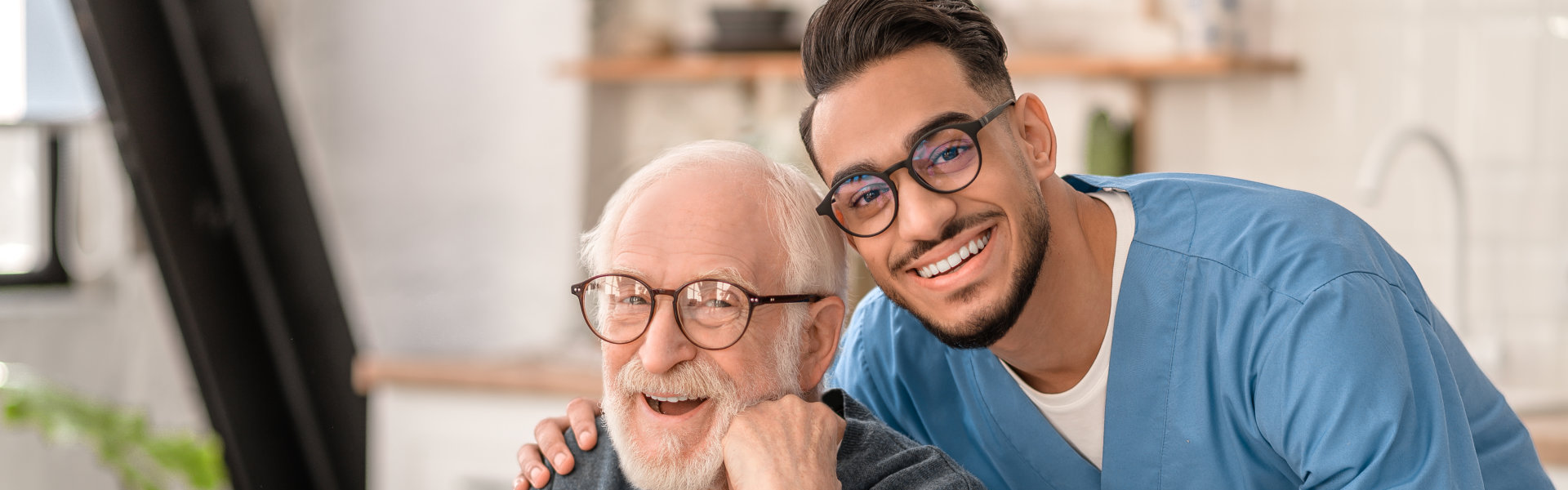 caregiver hugging the elderly