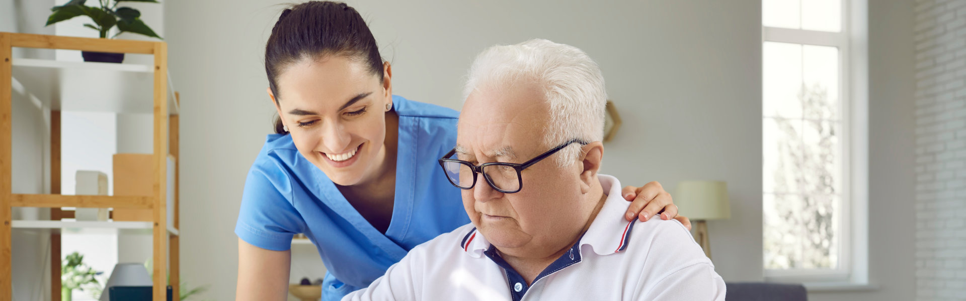 caregiver and elderly solving a puzzle